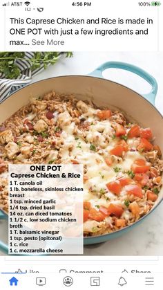 a pan filled with chicken and rice on top of a table