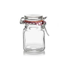 a glass jar with a red lid and metal clip on the top is shown in front of a white background