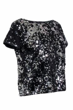 Shimmy and shine on your next night out in this dazzling Milly top! You're guaranteed to steal the spotlight with sparkling silver and black sequins adorning this chic party top. Complete with a bateau neckline and flattering scoop back, this shimmering shirt pairs well with leather pants and metallic heels for a glam look. Size 2 Shell 100% Polyester Lining 96% Polyester, 4% Spandex Made in USA Pullover Bateau neckline Scoop back Short sleeve Bust 37" Waist 37" Shoulder to hem 20.5" Sleeve length 6.5" Glamorous Glitter Blouse For Night Out, Glitter Blouse For Night Out Party Season, Chic Shiny Tops For Party Season, Glamorous Sequin Tops For Night Out, Shiny Summer Tops For Night Out, Chic Sequined Tops For Party Season, Spring Party Tops With Shine Detail, Glamorous Shiny Tops For Night Out, Glamorous Sequin Blouse For Night Out