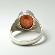 "Natural Certified Hessonite Garnet/Gomed 4.00 to 11.00 carat 92.5 Sterling Silver Astrology Ring For Men & Women.The product in display is a Gemstone and it is finished in an attractive Brown color. Wearing hessonite garnet helps in getting occupational success and fame, social reputation, wealth, marital bliss, and prosperity in life. Its mystic powers protect the wearer against evil spirits, rivals, enemies, dangerous plots, controversies, and the possibility of being poisoned. This fashi Concave Gemstone Rings As Gift, Amber Crystal Ring With Gemstone, Formal Moonstone Ring With Stone Setting, Amber Crystal Round Ring, Classic Opal Ring Collectible, Vintage Round Cabochon Gemstones, Amber Crystal Ring, Untreated Formal Rings, Vintage Round Gemstones For Gifts