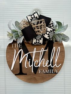 a wooden sign with the words, the mitchell family on it