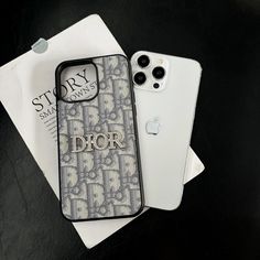 an iphone case with the word dior printed on it next to another cell phone