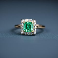 5mm Square Emerald Ring - 14k Gold Mined Emerald Ring - Halo Diamond Ring - Emerald Bridal Gifted Ring - Women Dainty Ring - Gift For Her GEMSTONE DETAILS : ✦ Gemstone : Natural Emerald ✦ Gemstone Size : 5 mm ✦ Gemstone Shape : Princess Square Shape ✦ Number of Gemstones : 1 ✦ Gemstone Weight : 0.90 Carat ✦ Gemstone Grade : AAA DIAMOND DETAILS : ✦ Diamond Type : Natural ✦ Diamond Size : 1.5 MM ✦ Diamond Color : G-H ✦ Diamond Clarity : Slightly included ✦ Diamond Cut : Excellent ✦ Diamond Weight Yellow Gold Emerald Diamond Ring With Halo Design, May Birthstone Jewelry With Princess Cut Center Stone, Fine Jewelry Yellow Gold Emerald Ring With Halo Design, Yellow Gold Emerald Ring With Halo Design, Formal Emerald Ring With Halo And Round Cut, Heirloom Yellow Gold Emerald Ring With Halo Design, Formal Emerald Ring With Halo, Formal Emerald Halo Ring Fine Jewelry, Formal Emerald Halo Ring With Round Cut