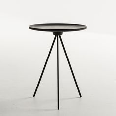 a round table with two black legs and a wooden top on a white background,