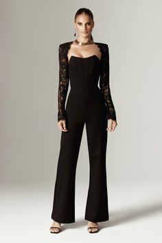 If you loved our Veva Dress , you'll love our jumpsuit version in 'Marisol’. It's cut from a soft Ponte de Rama stretch fabric and has a figure hugging silhouette to accentuate your curves. This version has a classic back hue that sets the tone for your most glamorous events and features a figure cinching boned bodice with the prettiest Guipure lace trim peeking from the neckline and sleeves.This specially developed Ponte De Roma fabric is soft with plenty of stretch and has a gorgeous Matt feel Jumpsuit Sleeves Design, Elegant Black Jumpsuit Wedding, Soft Dramatic Jumpsuit, Suit With Corset Top, Corset Jumpsuit Outfit, Prom Jumpsuit Classy, Black Jumpsuit Wedding, Casual Event Outfit, Prom Romper