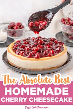 the absolute best homemade cherry cheesecake is on a plate and being drizzled with cherries