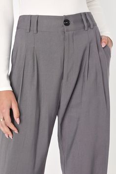 Per our last email, the Lulus Strictly Business Grey High-Waisted Trouser Pants are highly recommended for all boss babes! Lightweight woven twill creates a high waist (with a bit of elastic at the back), belt loops, and a brown marbled top button with a hidden zip fly. Pleated accents detail relaxed pant legs, with two diagonal pockets, that taper to ankle-length hems. Twin patch pockets at back. Fit: This garment fits true to size. Length: Ankle length. Size medium Inseam: 28.25 Front Rise: 13 High Waist Cotton Chinos For Business Casual, Cotton Tapered Leg Work Pants, Chic Relaxed Fit High-waisted Chinos, Chic High-waisted Relaxed Fit Chinos, Chic Cotton Bottoms For Business Casual, Chic Ankle-length Cotton Dress Pants, Chic Gray Pants, Gray Workwear Chinos, High Waist Relaxed Fit Cotton Dress Pants