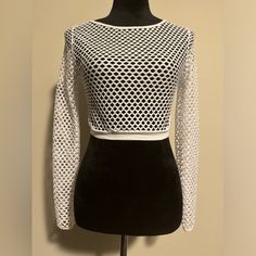 The Fashion Nova White Long Sleeve Mesh Top Is A Sleek And Versatile Piece That Adds A Touch Of Edgy Sophistication To Any Outfit. Whether You Layer It Over A Bralette For A Daring Evening Look Or Style It With High-Waisted Jeans For A Chic Daytime Ensemble, This Mesh Top Is Sure To Turn Heads With Its Modern And Trendy Vibe. Measurements Pit To Pit-15” Length-14.5” Sleeve Length-19.5” From Pit Bin 6 White Stretch Top With Hollow Out Details, Spring Crop Top With Hollow Out Design, Spring Hollow Out Stretch Crop Top, Stretch Hollow Out Crop Top For Spring, White Hollow Out Top For Party, Stretch Mesh Top With Hollow Out Long Sleeves, Trendy Fitted Hollow Out Top, Fitted Hollow Out Top For Summer, White Hollow Out Fitted Tops