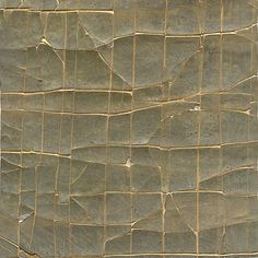 a close up view of an old, cracked surface