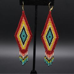 Handmade Beaded Earrings Beads Imported From Czech Color : Red - Pink - Yellow Bohemian Red Teardrop Jewelry, Traditional Red Beaded Earrings With Colorful Beads, Red Dangle Earrings With Ear Wire, Red Teardrop Beaded Earrings, Red Bohemian Dangle Earrings, Bohemian Red Dangle Earrings, Red Round Bead Earrings With Ear Wire, Red Dangling Beaded Earrings, Red Teardrop Beaded Earrings With Dangling Beads