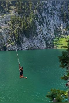 a person on a rope in the water