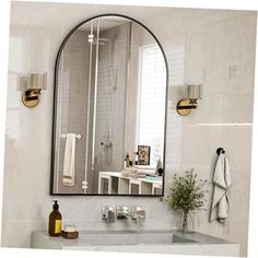 a bathroom with a sink, mirror and towel rack