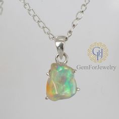 "Raw Opal pendant in Silver 925. Perfect Gift For Her as it gracefully goes along with every Outfit of The Day!  Reconnect with Nature and with yourself and Standout from the crowd by redefining yourself!  Club this Beauty with your outfit and don't forget to tag us on your social media #gemforjewelry PRODUCT DETAILS: - Base Metal: Solid Sterling Silver - Metal Purity: 925 - Metal Finish: Sterling Silver, Rhodium Over Silver, Rose Gold Overlay, Gold Overlay (Choose Finish in option) - Center Sto Raw Stone Jewelry, Raw Opal, Rough Opal, Unique Pendant, Opal Pendants, New Year Gifts, October Birth Stone, Perfect Gift For Her, Opal Jewelry