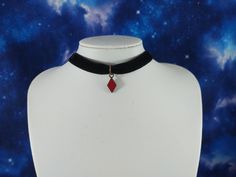 This is a Alice in Wonderland inspired black velvet choker that features a mini diamond card suit charm. It is made with 3/8 inch black velvet, and a small enameled metal diamond charm. The necklace is 14 inches long and features a 2 inch extender chain. DETAILS: *      3/8 inch black velvet ribbon  *Uses stainless steel metal = safer for sensitive skin / won't fade or turn green  *Red enamel and antique gold metal red diamond charm SIZING:  *14 inches in length *       2 inch extension chain so Diamond Card, Alice In Wonderland Inspired, Choker Black, Black Velvet Choker, Velvet Choker, Red Diamond, Black Choker, Necklace Minimalist, Diamond Charm