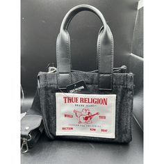 This Stylish True Religion Mini Tote Bag Is Perfect For Casual Occasions. The Square-Shaped Denim Bag Is Adorned With A Logo Pattern Featuring A Buddha Character, Giving It A Unique Touch. The Bag Has A Natural Exterior Color And Silver Hardware Accents. It Comes With A Detachable Cross-Body Strap And A Leather And Fabric Crossbody Strap Handle. The Bag Has A Snap Closure And Outer Pockets With Adjustable Straps. The Lining Is Made Of Denim Fabric, Giving It A Cool And Chic Vibe. This New With T Bella Hadid True Religion, Streetwear Denim Bags With Pockets, True Religion Purse, True Religion Zip Up, True Religion Jacket, Purse Outfit, Luxury Bags Collection, Purse Crossbody, Denim Tote Bags