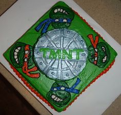 there is a cake that says mutant on the front and green with red trims