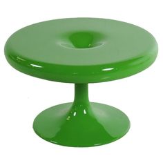 a green cake stand on a white background