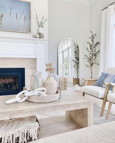 a living room filled with furniture and a fire place in front of a painting on the wall