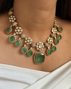 The Emerald Green Uncut Diamond Kundan Necklace Set is a stunning piece of jewelry that draws inspiration from the grandeur of Sabyasachi's designs and the opulence of Bollywood fashion. This statement necklace set is meticulously handcrafted, featuring uncut diamonds set in traditional Kundan style, which is known for its intricate detailing and elaborate craftsmanship. The rich emerald green stones add a vibrant touch, symbolizing luxury and elegance. Each uncut diamond is carefully placed to Necklace For Green Saree, Luxury Green Stone Work Sets, Luxury Green Kundan Necklace For Wedding, Emerald Jewelry Necklace, Kali Mantra, Emerald Green Stone, Kundan Necklace Set, Kundan Necklace, Green Stones