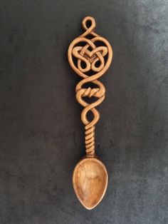 This love spoon measures appropriately 27.8 cm long by 6.5 cm wide.  Love spoons were historically full of symbolism which I have tried to incorporate within a modern setting. I always include a hand written card explaining the symbolism of each design. This design has a barely twist = two lives becoming one nd celtic knotwork hearts = everlasting love.  Love spoon making has a long tradition in Wales dating back to the early 1600's. The designs were driven by the passion of carvers who sought to produce works of art worthy of their beloved.  Love spoons are now given as wedding gifts, anniversary's, birthdays, collectibles and mementos of Wales.   I use Welsh Cherry wood which has the added meaning of a wish for a fruitful life. Each design is available in: -Natural Cherry (warm colour) - Welsh Love Spoons, Hand Carved Wooden Spoons, Love Spoons, Carved Spoons, Celtic Knotwork, Everlasting Love, Hand Written, Wooden Spoons, Cherry Wood