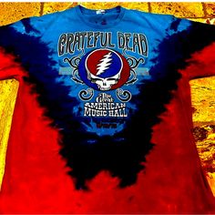 Excellent Condition Grateful Dead Tie-Dyed T-Shirt. Not That Many Left Around. Blue Pre-washed Tops For Spring, Spring Blue Pre-washed Tops, Spring Blue Pre-washed Top, Blue Tops For Fall Fan Merchandise, Red Cotton Festival Top, Band Merch Cotton Shirt For Festival, Cotton Band Merch Shirt For Festival, Summer Blue Pre-washed Tops, Blue Crew Neck Shirt With Band Merch