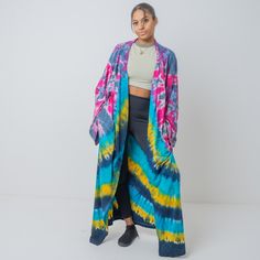 Zinnia Pearl Complete your look with this gorgeous tiedye kimono featured in a shapeless, flowy silhouette and open front style with an eye-catching allover hand tiedye design, wide, dropped sleeves. Size: One plus size Color: multicolor  Finish: super soft, Comfortable, matte, drape well Weight: medium Measurements:  bust 64 in (relaxed) Waist 72 in Sleeve Length: 29 in Length: 55 in Armholes width 12.5 in Fabrics: 100% cotton - high quality knit jersey fabric - light stretch Details: Open fron Hippie Multicolor Open Front Kimono, Long Relaxed Fit Kimono For Festivals, Long Hippie Style Beach Outerwear, Long Hippie Beach Outerwear, Long Hippie Outerwear For Beach, Hippie Long Outerwear For Beach, Hippie Long Beach Outerwear, Summer Hippie Outerwear For Vacation, Hippie Summer Outerwear For Vacation