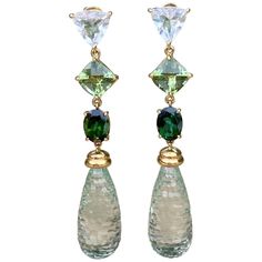 Prasiolite briolette drop earrings with beautiful shades of blue and green tourmalines and white topaz, handcrafted in 18 karat yellow gold. Gorgeous shades of green are reflected in these stunning one-of-a-kind prasiolite briolette and multi-tourmaline dangle earrings. Refreshing and elegant, these icy green beauties add a touch of chic to any look. Elegant Formal Earrings, Prasiolite Jewelry, Fantasy Accessories, Blessed Wednesday, Formal Earrings, Earrings For Sale, Engagement Sets, Soft Autumn, Long Dangle Earrings