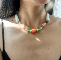 So summery, bright and happy! This pretty 1960s vintage necklace features one centre carved orange ceramic beads, green ,clear , pink  and blue Java glass round beads in two sizes, and flat round resin chips in orange, pink, brown colour. There are two big white ceramic beads and other small beads.  The closure is  925 silver. This necklace is in very nice vintage condition, with no apparent issues. Send from France.  Everything I share here is vintage, it means they are old and original and can have signs of age. That's the beauty of it ( in my eyes). But I will let you know any notable features or damage. Feel free to contact me with any questions :) Thank you for visiting and enjoy your shopping!  Chez Echo Vintage  https://chezechovintage.etsy.com Multicolor Recycled Glass Bead Jewelry, Multicolor Recycled Glass Beaded Jewelry, Retro Necklace With Large Beads For Gift, Retro Large Beads For Gifts, Colorful Beaded Necklace Of Recycled Glass For Gifts, Colorful Recycled Glass Beaded Necklace As Gift, Colorful Beaded Recycled Glass Jewelry As Gift, Colorful Recycled Glass Beads Necklace For Jewelry Making, Colorful Recycled Glass Bead Jewelry As Gift