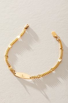 Great for gifting or gracing your own jewelry collection, this stunning bracelet is the perfect blend of cool and classic with a defined chain, satellite sunburst pendants, and personalized placket at center for a super unique finishing touch. * 14k Gold Filled 3.4mm sunburst chain * 14k Gold Filled 6x19mm hand-stamped initial pendant * Length: 7" * 5 days of production | Set & Stones Personalized Rosie Bracelet at Free People in Gold Initial Pendant, Womens Jewelry Bracelets, Hand Stamped, Gold Filled, Jewelry Collection, Jewelry Accessories, Initials, Free People, Women Jewelry