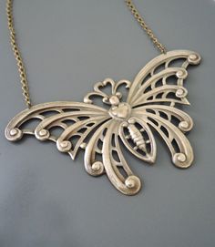 "Vintage Jewelry - Art Nouveau Necklace - Butterfly Necklace - Statement Necklace - Brass Necklace - Chloe's Vintage handmade jewelry This is such a stunning statement necklace! A large vintage brass butterfly hangs from a pretty brass ladder chain. So very bold and feminine. Chloe says, \"Wear it and feel fabulous!\" This pendant is 4\" wide and 2 1/4\" tall. You can choose the necklace length you would like at checkout. Thanks for visiting Chloe's" Handmade Bronze Necklaces For Wedding, Metal Necklace For Gift, Decorative Metal Necklace As Gift, Decorative Metal Necklace For Gift, Unique Nickel Free Necklace For Wedding, Artistic Silver Jewelry With Decorative Details, Decorative Costume Jewelry Necklaces For Gifts, Artistic Silver Decorative Jewelry, Decorative Costume Jewelry Necklace For Gifts