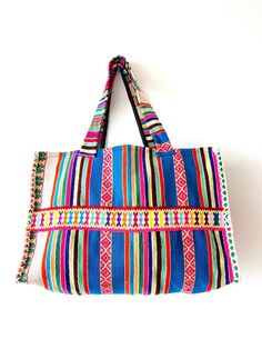 This bag was produced from the recycled handmade traditional fabric of the Andean highlands. Black lining inside with a pocket. Measurements:  Height: 12.5 inches (32 cm) Flat width: 19 inches (48 cm) Depth/Gusset: 6.5 inches (17 centimeters) Drop down strap length: 11 inches (28 cm) / Handle length: 25 inches (64 cm) Blue Bohemian Tote Canvas Bag, Rectangular Travel Bag With Weaving Work, Blue Bohemian Canvas Tote Bag, Woven Travel Tote Bag, Artisan Tote Bag For Festival, Traditional Tote Canvas Bag For Everyday Use, Traditional Woven Tote Satchel, Travel Tote Bag With Weaving Work, Artisan Blue Tote Bag