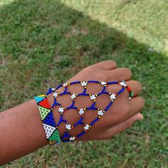 100 % Hand made. This Zulu beaded glove is also a Zulu love letter. Depending on the colors. Makes a great gift for Brides or Girlfriend. It adds a spark to any outfit. It is 8.5 inches long fits most adults . Unique Blue Beaded Bracelets For Festival, Festival Beaded Bracelets With Black Beads, Colorful Beaded Bracelets For Festival, Festival Beaded Adjustable Wristlet, Black Beaded Bracelets For Summer Gifts, Adjustable Beaded Wristlet For Festival, Blue Unique Beaded Bracelets, Adjustable Beaded Jewelry For Festival, Traditional Beaded Bracelet For Summer Gift