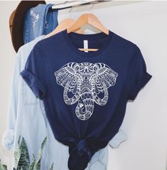 ABOUT OUR Elephant Shirt: PRODUCTION TIME: 1-3 days (Usually 2 days) SHIPPING TIME: 2-5 days (Usually 3 days) PRODUCT DESCRIPTION: Bella Canvas Unisex T-shirt Super soft cotton and excellent quality print makes. 100% Soft cotton (fibre content may vary for different colors) Light fabric (4.2 oz/yd² (142 g/m Runs true to size Our Relaxed Fit Tee (Bella + Canvas style 3001) is a unisex style that runs a touch small for men, and about a half a size large for women. It's a relaxed fit and is soft an Bohemian Blue Printed T-shirt, Blue Bohemian Shirt With Graphic Print, Bohemian Blue Printed Shirt, Blue Bohemian Cotton T-shirt, Bohemian Blue T-shirt With Graphic Print, Bohemian Blue Graphic Print T-shirt, Blue Bohemian Graphic Print T-shirt, White Bohemian Top With Graphic Print, White Bohemian Top With Screen Print