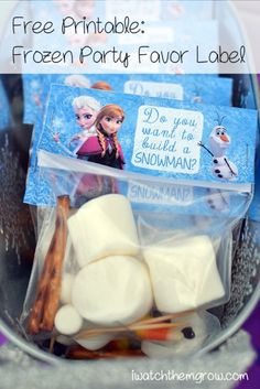 some marshmallows and cinnamon sticks in a plastic bag with frozen princess stickers on them