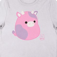 Spend some time with your favorite Squishmallows tee. The shirt features an image of Patty the Cow sitting next to pink letters that spell out her name. The tee comes in a white short sleeve crew neck. Squishmallows fans will love this comfy cotton tee. Cute Pink T-shirt With Funny Print, Pink Funny Print Fun T-shirt, Pink Fun T-shirt With Funny Print, Cute Pink T-shirt With Cartoon Print, Kawaii Pink Top With Screen Print, Pink Kawaii Top With Screen Print, Pink Funny Print T-shirt, Playful Pink T-shirt With Screen Print, Funny Pink Crew Neck T-shirt