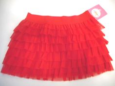 NWT Girls Circo Layered Tutu Skirt. The outside is layered with 100% polyester tulle and the inner lining is 100% cotton. Elastic waistband for proper fit and comfort. Can be worn from casual everyday wear to fancy special occasions. Very Cute!! Available in size 6/6X Cute Red Ruffled Skirt, Red Stretch Skirt With Ruffles, Layered Tutu Skirt, Girl Tutu Skirt, Tutus For Girls, Tutu Skirt, Casual Everyday, Toddler Girls, Cheer Skirts