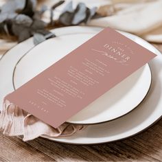 a table setting with plates, napkins and silverware