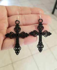 New  Handmade  Black Cross Earrings  ♡ Black filigree Cross Dangle Earrings  ♡ Measure 2.25 inches long  ♡ Lightweight  ♡ .925 sterling silver ear hooks ♡ Stainless steel black powder coated cross charms  Matching necklace ~ Stainless steel black double strand cable chain measures 16 inches, plus has a 2 inch extender  ~ Lobster clasp closure ~ Cross measures 2 inches long x 1.25 inches wide ♡ Ships within 24 hours of purchase Monday-Saturday Gift Packaging & Messages: Your item will be lovingly Black Cross Earrings, Earrings Goth, Gothic Cross, Womens Earrings, Gothic Crosses, Black Cross, Schwarz Gold, Peridot Gemstone, Cross Earrings