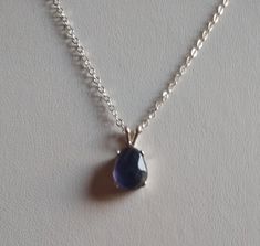 18 in genuine iolite pendant with sterling 1.7 mm cable link chain sterling spring ring clasp Iolite is indigo blue color with violet undertones, natural color, 10 x 8 mm approx 1/2 x 3/8 in pendant 16 x 8 mm approx  6/8 x 3/8 in all silver is 925 sterling Silver Teardrop Cable Chain Jewelry, Sterling Silver Teardrop Pendant With Cable Chain, Sterling Silver Jewelry With Teardrop Pendant And Cable Chain, Silver Teardrop Jewelry With Cable Chain, Sterling Silver Teardrop Cable Chain Jewelry, Faceted Sapphire Silver Jewelry, Hypoallergenic Sterling Silver Briolette Jewelry, Blue Faceted Amethyst Jewelry, Faceted Blue Amethyst Jewelry