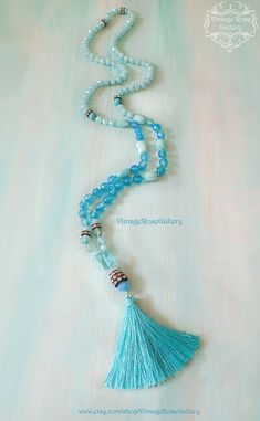 "Turquoise Silk Tassel Necklace, Turquoise Agate Gemstones Necklace, Turquoise Boho Chic Necklace, Bridesmaid Gift A gorgeous Turquoise Agate Gemstones, Hand knotted , Long Tassel Necklace with rhinestones and crystal beads ! Features antique rhinestones, beautiful turquoise agate faceted gemstones 8mm , light blue crystal beads of different shapes, an amazing aqua quartz , turquoise gemstones all carefully hand knotted and a gorgeous turquoise silk tassel This necklace is so beautiful , with so Turquoise Aquamarine Spiritual Necklace, Elegant Blue Tassel Necklace As Gift, Elegant Blue Tassel Necklace Gift, Turquoise Beaded Tassel Necklace Gift, Adjustable Turquoise Tassel Necklace For Gift, Blue Bohemian Tassel Necklace For Gift, Handmade Blue Tassel Necklace As Gift, Bohemian Aquamarine Jewelry, Blue Tassel Necklace As Gift