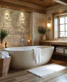 a large white bath tub sitting next to a window