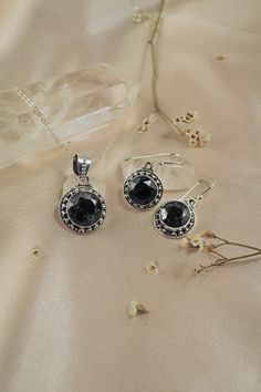 Aurora is a stunning earrings and necklace jewelry set featuring round cushion cut Black Onyx gemstones nestled inside a finely detailed, sterling silver frame. Amalfi jewelry set is the perfect pick-me-up when you need that extra sparkle with it's ethereal, vintage-inspired design in silver. Black Onyx is a powerful protection stone, it absorbs and transforms negative energy, and helps to prevent the drain of personal energy. Black Onyx aids the development of emotional and physical strength an Sterling Silver Formal Jewelry Sets, Elegant Sterling Silver Jewelry Sets With Stone Setting, Formal Black Round Jewelry Sets, Silver Sterling Silver Jewelry Sets, Round Sterling Silver Jewelry Sets, Victorian Style Silver Onyx Jewelry, Victorian Silver Onyx Jewelry, Silver Jewelry Sets With Stone Setting, Elegant Silver Jewelry With Black Spinel