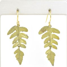 Handmade in the USA Bronze with soft green patina Gold filled french ear wires Earrings measure 1.5" long ABOUT SILVER SEASONS Silver Seasons Jewelry collection is brought to you by designer Michael Michaud. Known for his nature-inspired metal work, Michaud casts his pieces from real plant life and other natural specimens. Designs include everything from statement leaf necklaces to realistic flower earrings, bangle bracelets, drop earrings, and pendants. ABOUT GOLDMAKERS Goldmakers Jewelry creates and curates a comprehensive selection of artfully designed hand-crafted jewelry. We aspire to offer the jewelry enthusiast access to affordable classics as well as fresh innovative designs. Green Brass Earrings Nature-inspired, Nature-inspired Drop Earrings With Lever Back Ear Wires, Botanical Green Jewelry With Ear Wire, Botanical Leaf-shaped Earrings With Ear Wire, Nature-inspired Hand Forged Gold Earrings, Gold Nature-inspired Hand Forged Earrings, Nature-inspired Leaf Shaped Brass Jewelry, Leaf-shaped Brass Earrings With Ear Wire, Green Hand Forged Brass Earrings