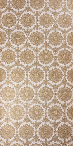 an old wallpaper pattern in gold and white