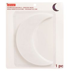 a white crescent shaped paper plate on a card