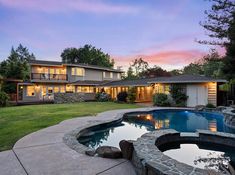 a house with a pool in the front yard