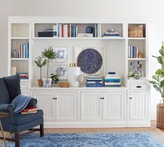 an image of a living room with bookshelves and vases on the shelves