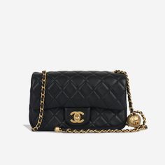 The Chanel Pearl Crush mini rectangle flap bag is crafted from lambskin leather with brushed gold-tone hardware, this perfect piece is difficult to get your hands on but the perfect accessory to take you from day to evening. This mini Chanel is the ideal compliment to any outfit for any occasion. SPL Exterior Black quilted lambskin lack leather Brushed gold tone hardware Interwoven chain / leather strap with adjustable pearl crush ball CC twist-lock clasp Slip pocket at rear Plaque series Great condition - some rubbing to the seams and corners Interior Contrasting gold leather lining Single compartment Slip pocket Zip pocket Chanel embossed leather logo Great condition - some light scratches inside/under flap Comes with box and dust bag SPL Height 12.5cm Width 20cm Depth 7cm Chanel Mini Pearl Crush, Chanel Mini Classic Flap, Chanel Pearl Crush Bag, Small Bag Outfit, Chanel Pearl Crush, Chanel Bag Outfit, Luxury Wishlist, Chanel Mini Bag, Mini Chanel