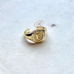 Free People X Bracha Initial Medallion Gold Signet Ring Brand New In Package Letter/Initial E Initial Medallion Signet Ring Gives Us All The Feels. Timeless, Vintage Romantic Style... Complete The Look With Our Signature Initial Medallion Necklace. 18k Gold Plated Over Sterling Silver Size 7 With Open Back To Adjust To Your Size Adjustable Sizing Engraved Initial Made In Usa Free People Rings, E Initial, Signet Ring Gold, Initial E, Pink Stone Rings, Free People Jewelry, Engraved Initials, Bronze Ring, Gold Signet Ring