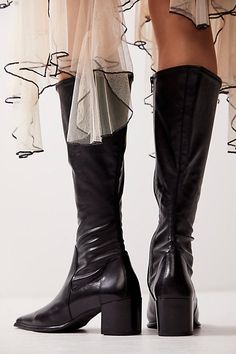 An absolute closet staple, these essential leather boots from Vagabond are featured in a mid-calf height with a stretchy shaft and dramatic pointed toe. **Features:** Mid-calf length, leather base, stretchy faux leather shaft, inner leg zipper, pointed toe, chunky block heel **Why We | Giselle Mid Boots by Vagabond Shoemakers at Free People in Black, Size: EU 39 Tall Mid-calf Heeled Boots For Fall, Mid-calf Heeled Boots For Fall, Fitted Knee-high Boots With Sculpted Heel For Fall, Fitted Mid-calf Platform Boots For Fall, Fitted Ankle Wedge Boots For Fall, Fitted Wedge Ankle Boots For Fall, Fitted Platform Boots With Stacked Heel For Fall, Edgy Wide Calf Mid-calf Boots For Fall, Fitted Knee-high Platform Boots With Sculpted Heel